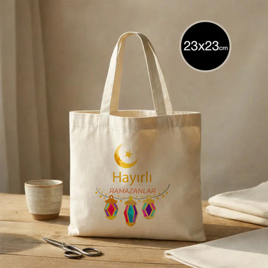 23x23 cm küçük ham bez çanta, Ramazan temalı hilal ve fener baskılı “Hayırlı Ramazanlar” yazılı bayram hediye çantası