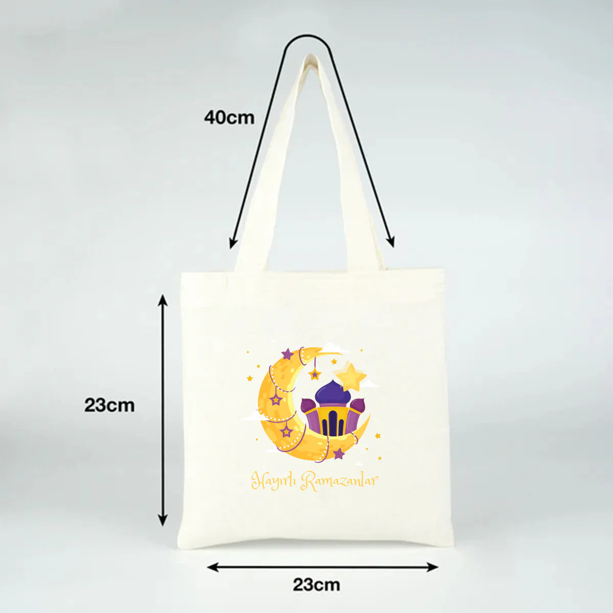 23x23 cm ölçülü küçük bez çanta, 40 cm kulplu; hilal-yıldız ve cami baskılı “Hayırlı Ramazanlar” Ramazan Bayramı hediye çantası.