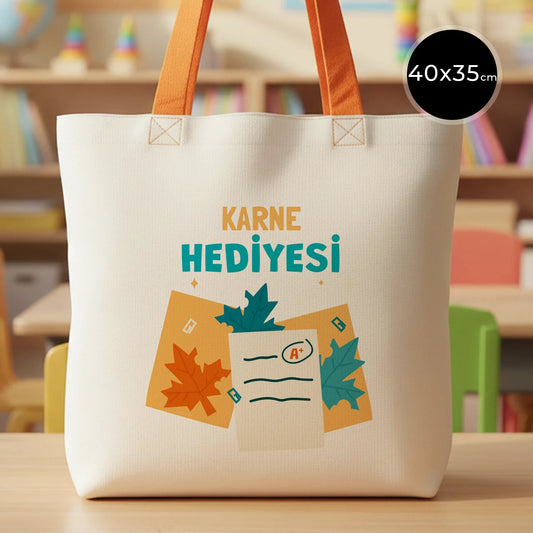 40×35 cm doğal renkli kumaş çanta, turuncu askı detayları ve ön yüzünde karne temalı renkli baskı bulunan model.