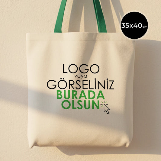 Yeşil kulplu, ham bezden üretilmiş 35x40 cm boyutlarında günlük kullanım için pratik çanta.
